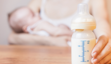 Woman choosing whether to breastfeed her baby or not. Feeding the Controversy - Breast is Best...But Not Always