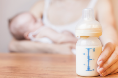Woman choosing whether to breastfeed her baby or not. Feeding the Controversy - Breast is Best...But Not Always